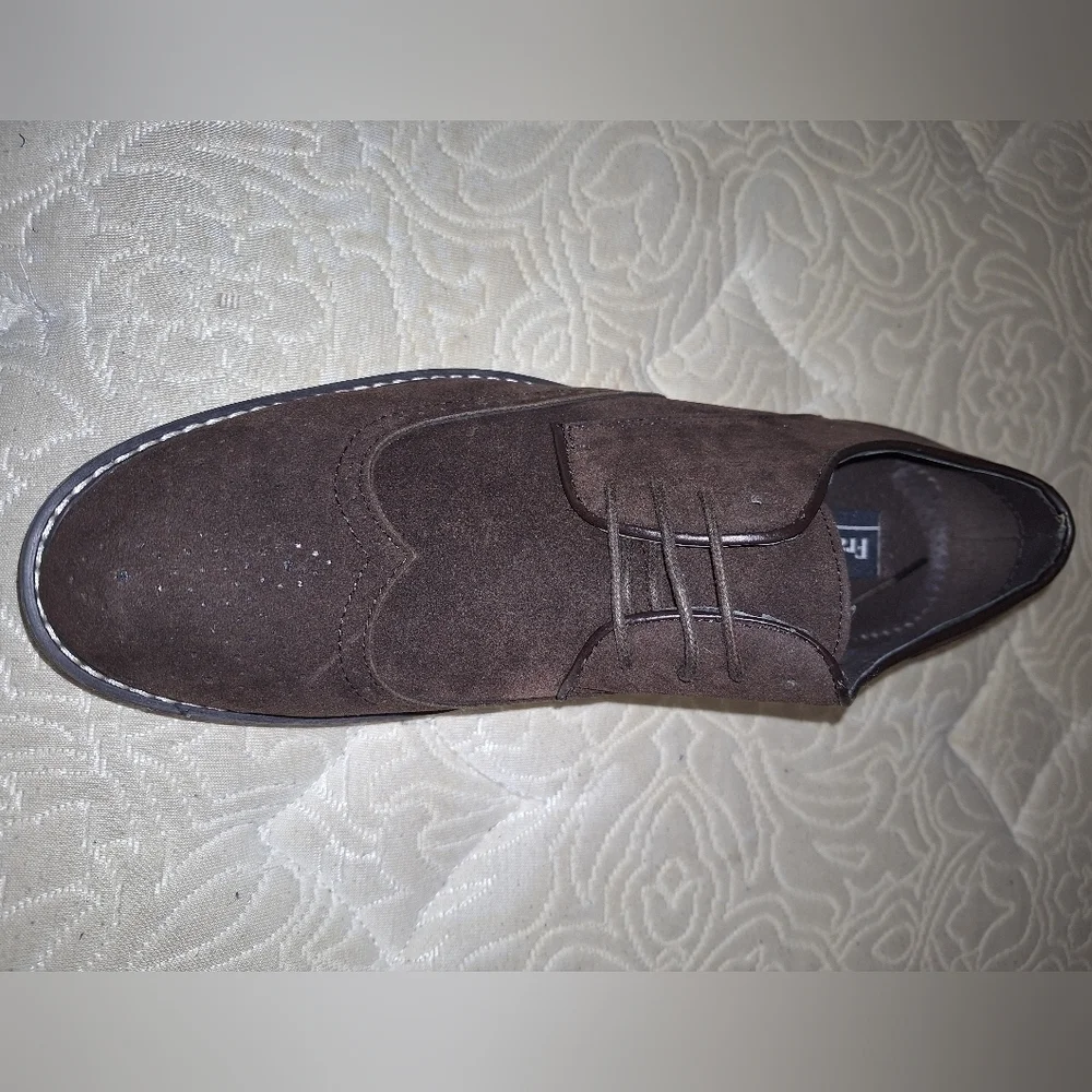 A pair of Franco Vanucci brown suede men's loafers in a size 10.5. EUC.